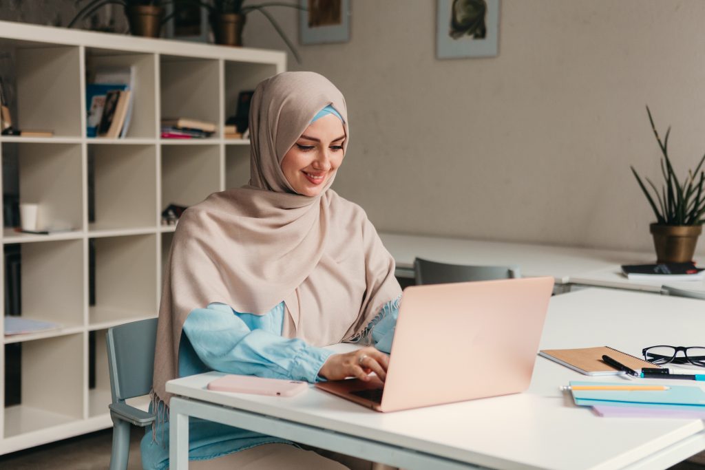 modern muslim woman in hijab in office room